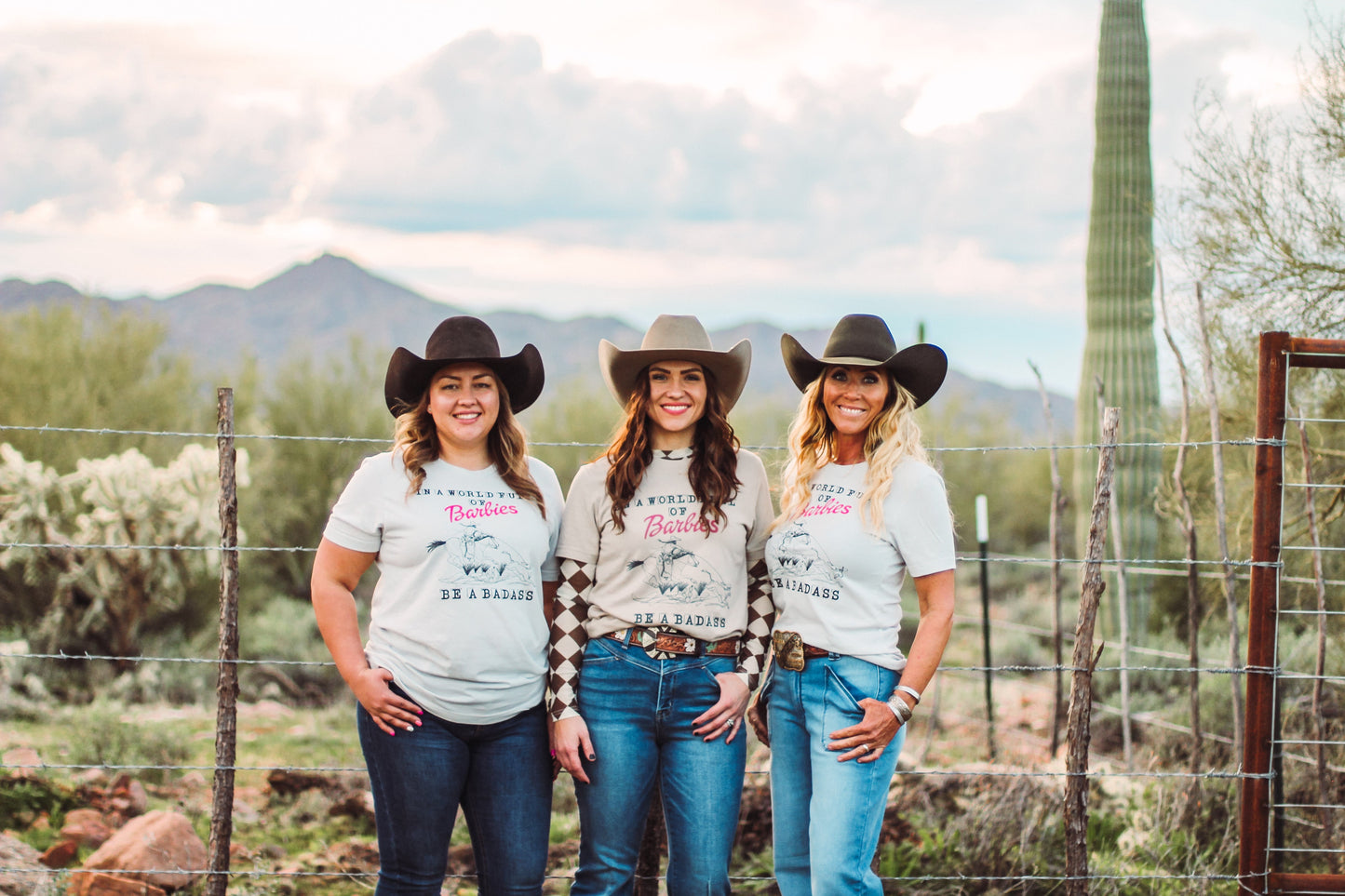 In A World Full of Barbies Be A Badass Western Graphic Tee